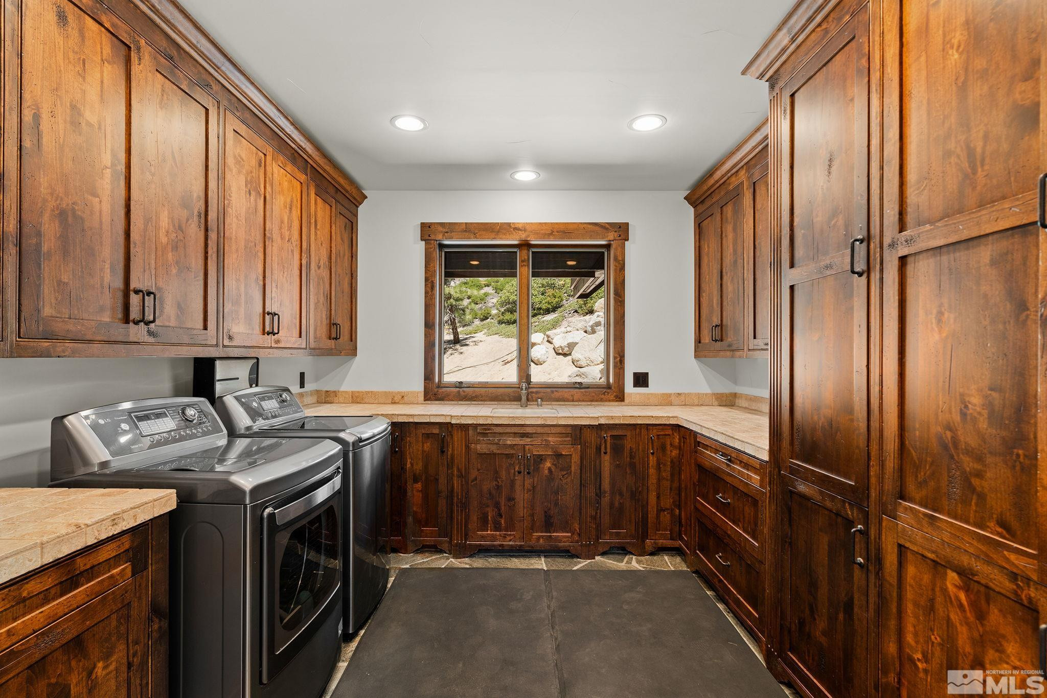 797 Ida Court Incline Village, NV 89451 - Photo 31 of 39 a kitchen with stainless steel appliances granite countertop a sink stove and refrigerator