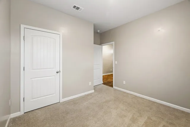 a bathroom with a granite countertop sink a toilet and bathtub