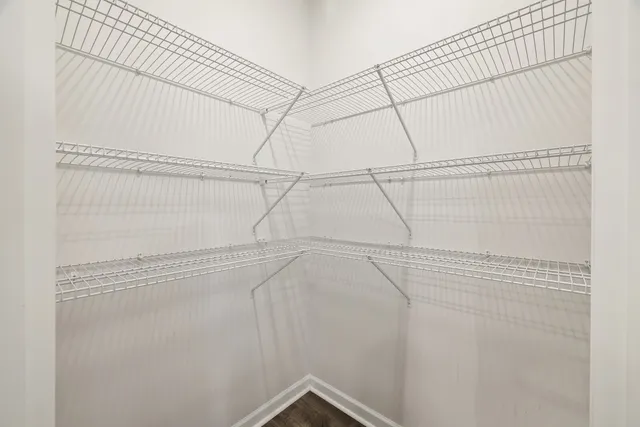 a view of a kitchen with granite countertop cabinets and wooden floor