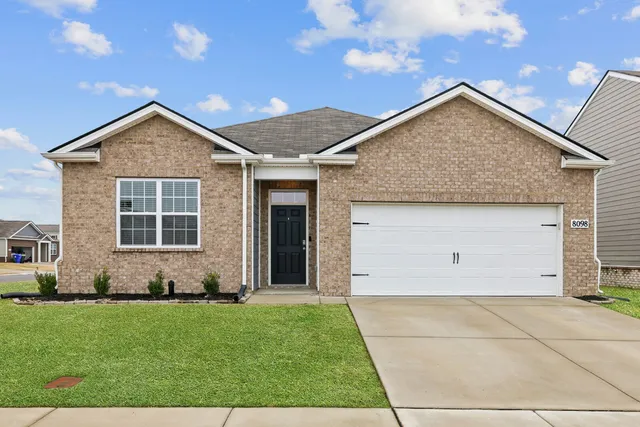 a view of front house with yard