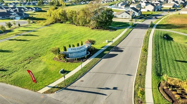 a view of a park with large trees