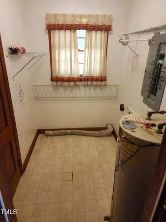 a bathroom with a sink and a window
