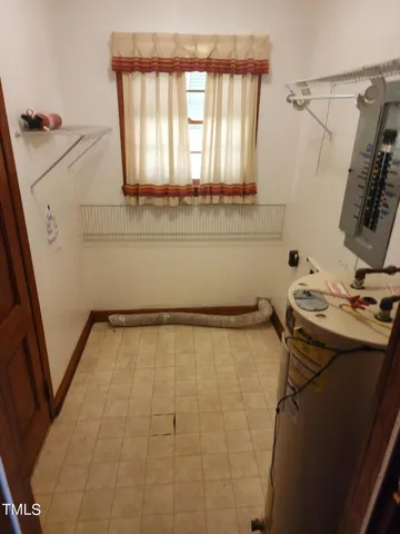 a bathroom with a sink and a window