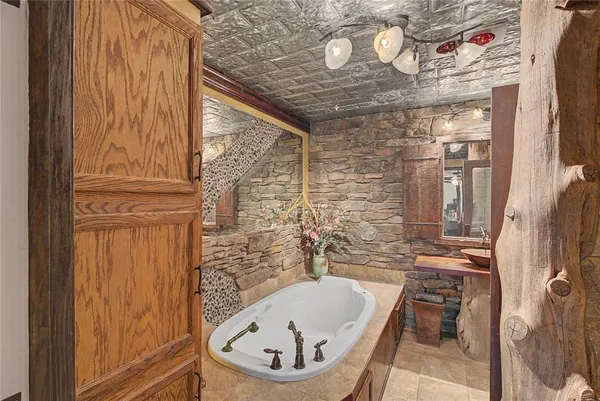 a bathroom with a tub and shower