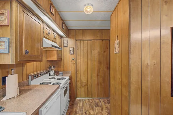 a bedroom with a bed dresser and a window