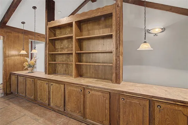 a kitchen with a sink and cabinets