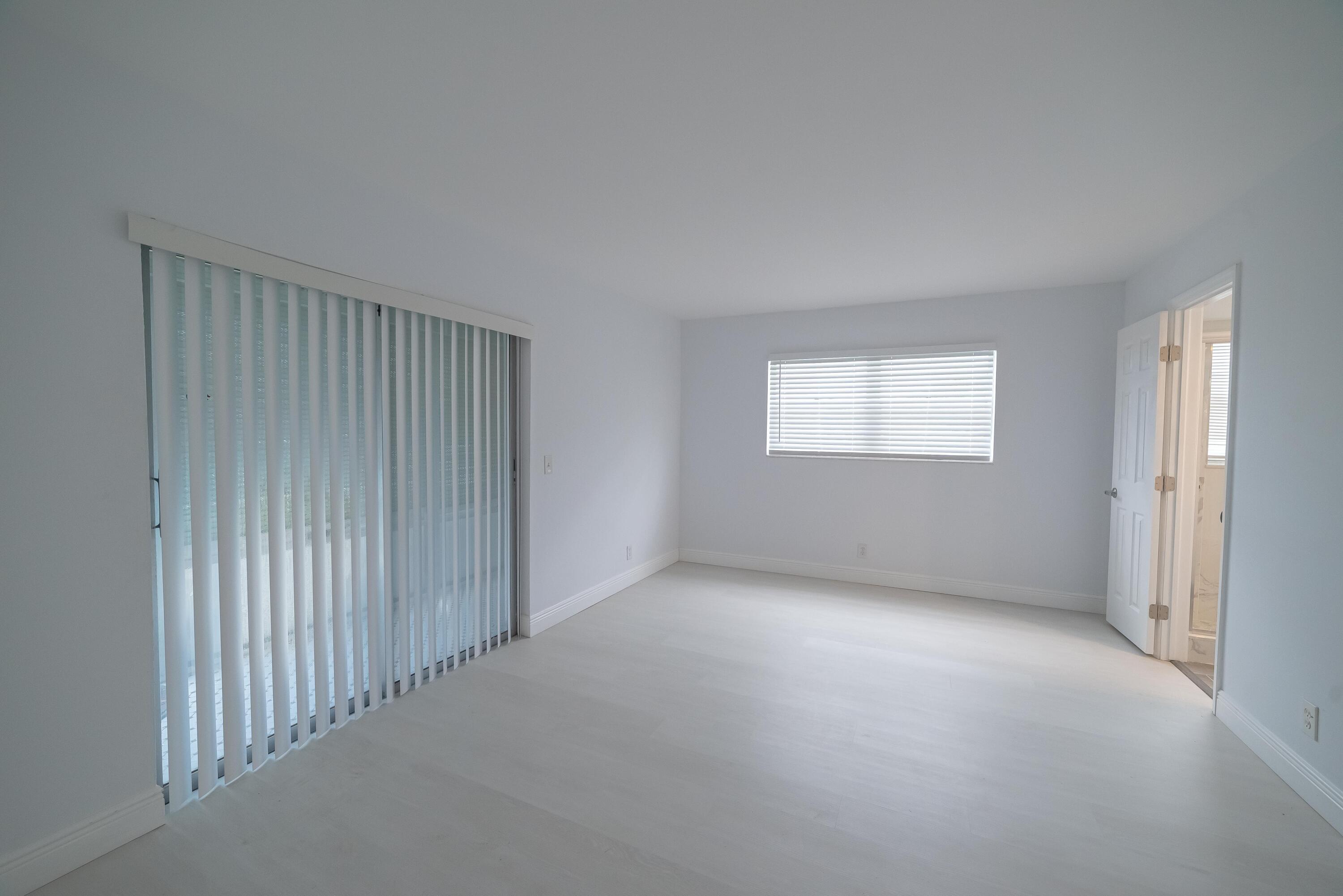 53 Lyndhurst East, Unit C Deerfield Beach, FL 33442 - Photo 15 of 23 a view of an empty room with a window