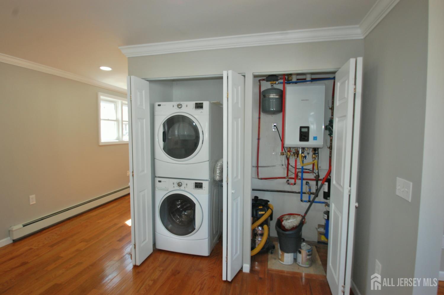 807 6th Street Union Beach, NJ 07735 - Photo 13 of 44 a view of a hallway with washer and dryer