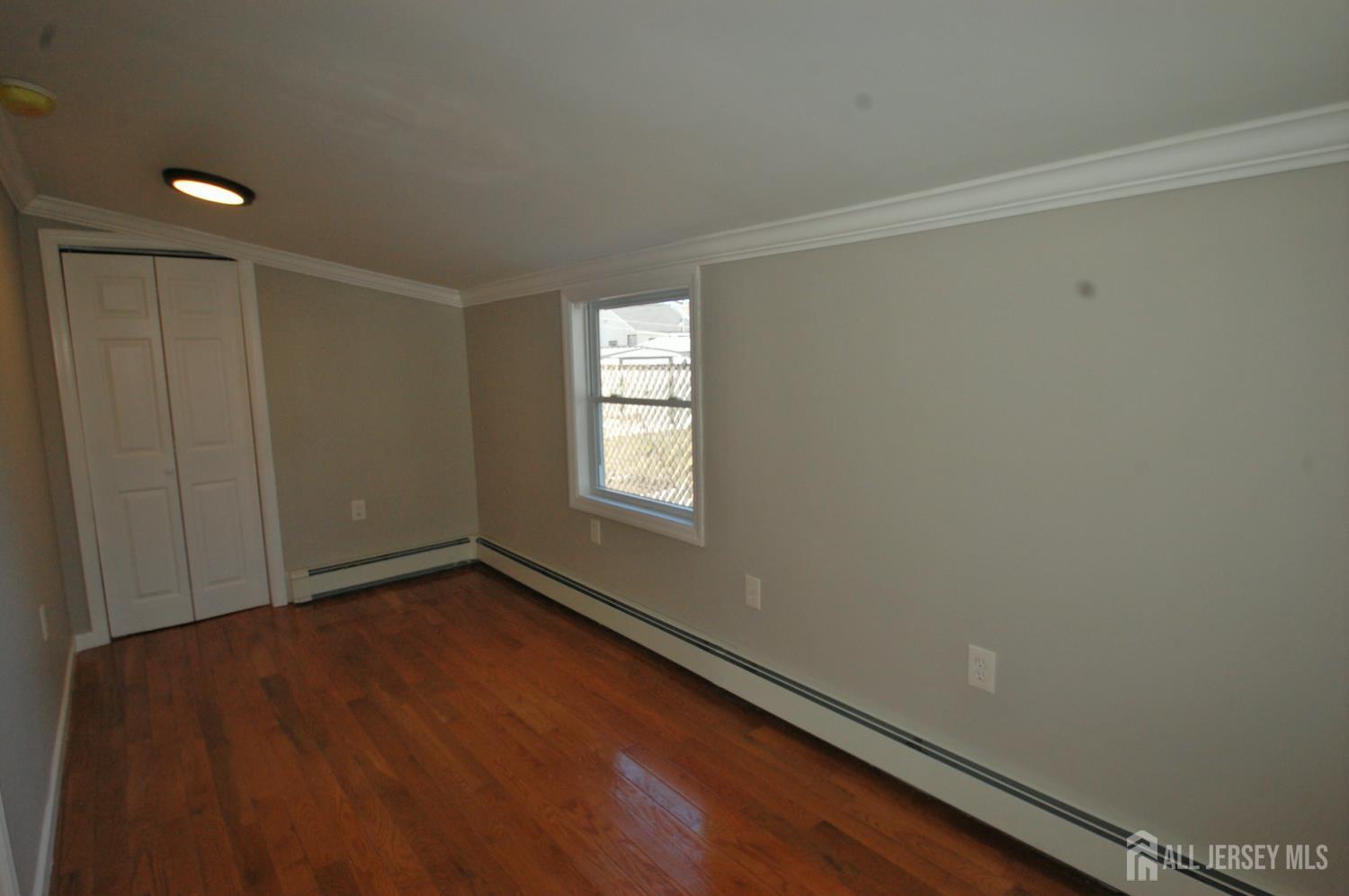 807 6th Street Union Beach, NJ 07735 - Photo 24 of 44 an empty room with a window