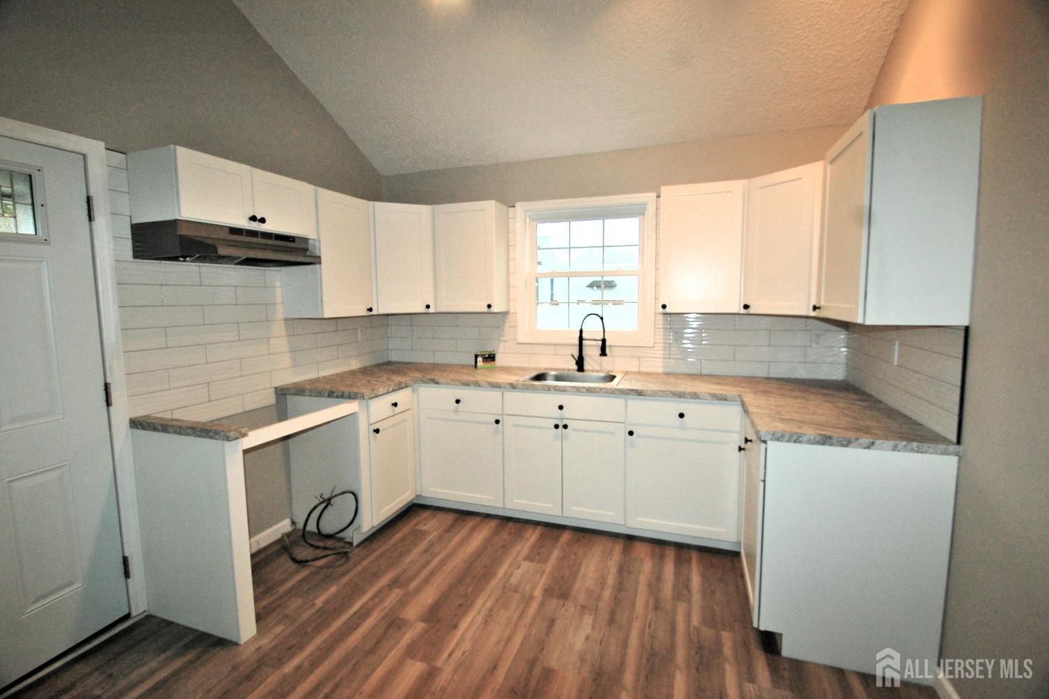 807 6th Street Union Beach, NJ 07735 - Photo 30 of 44 a kitchen with sink cabinets and window