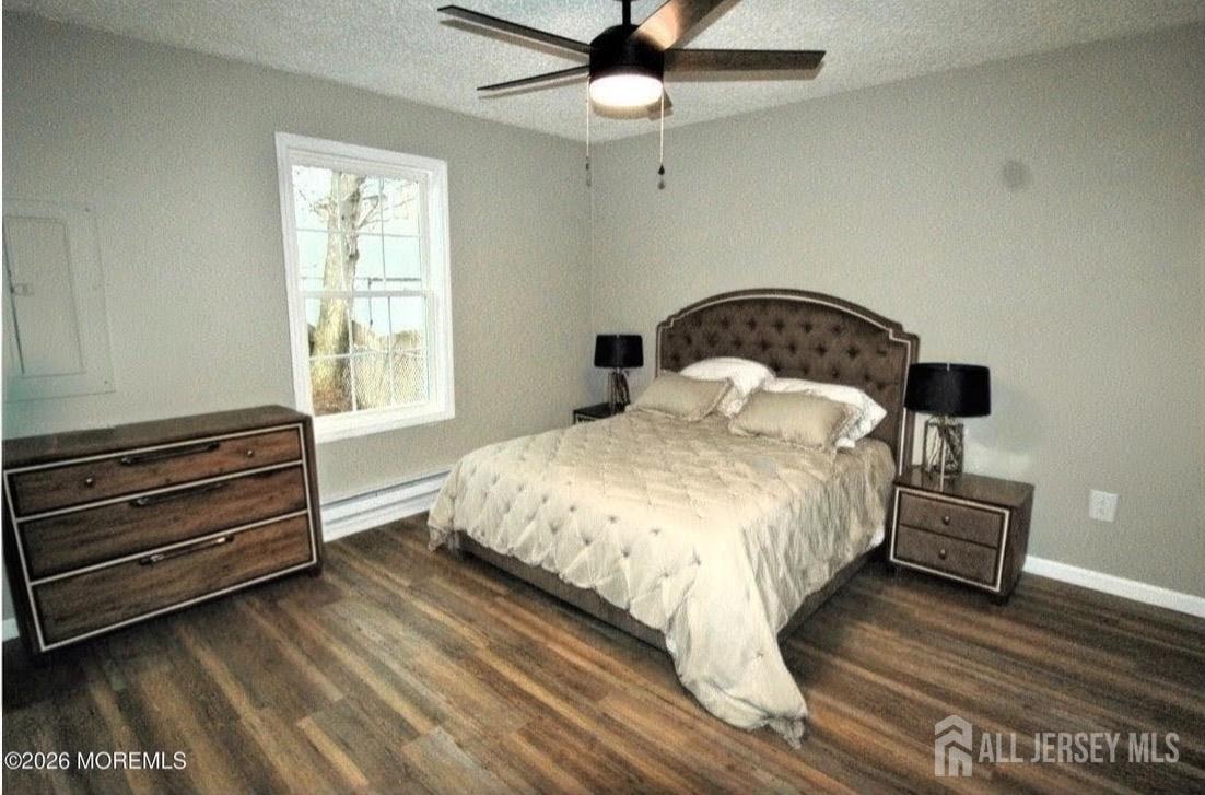 807 6th Street Union Beach, NJ 07735 - Photo 36 of 44 a bedroom with a bed and wooden floor