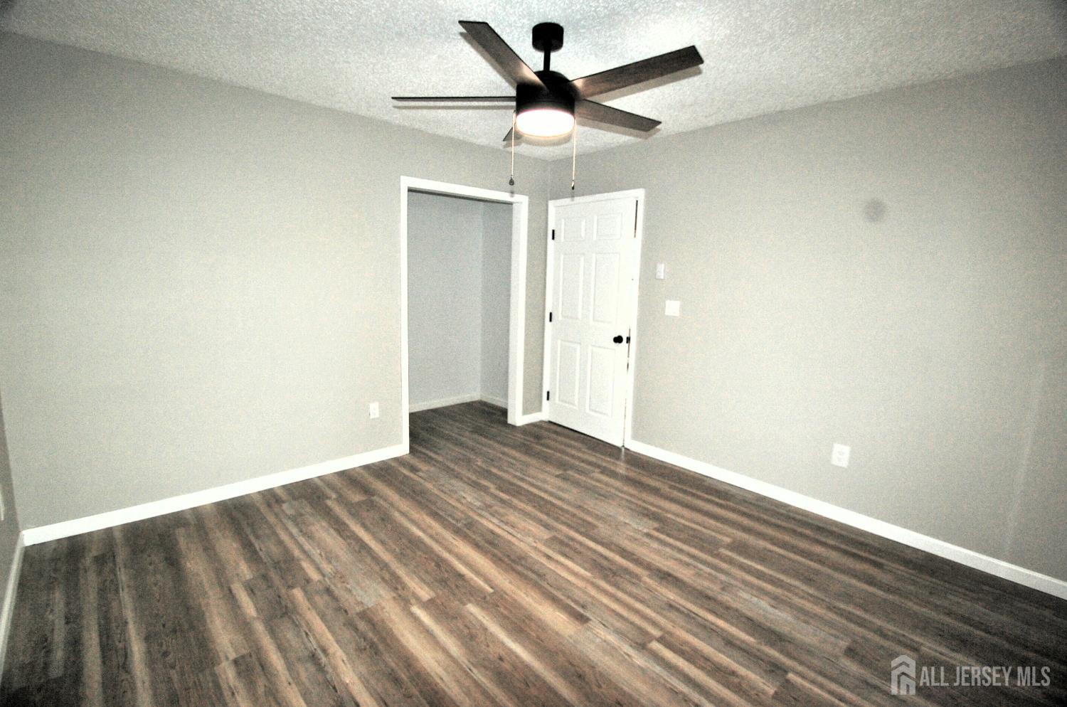 807 6th Street Union Beach, NJ 07735 - Photo 38 of 44 wooden floor in an empty room