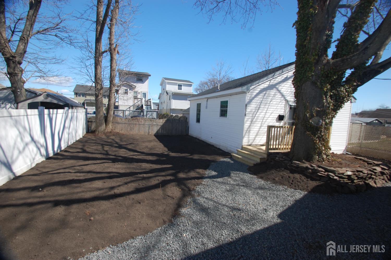 807 6th Street Union Beach, NJ 07735 - Photo 44 of 44 a front view of a house with a yard