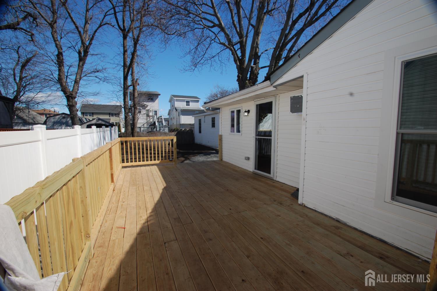 807 6th Street Union Beach, NJ 07735 - Photo 5 of 44 a view of a house with a wooden deck