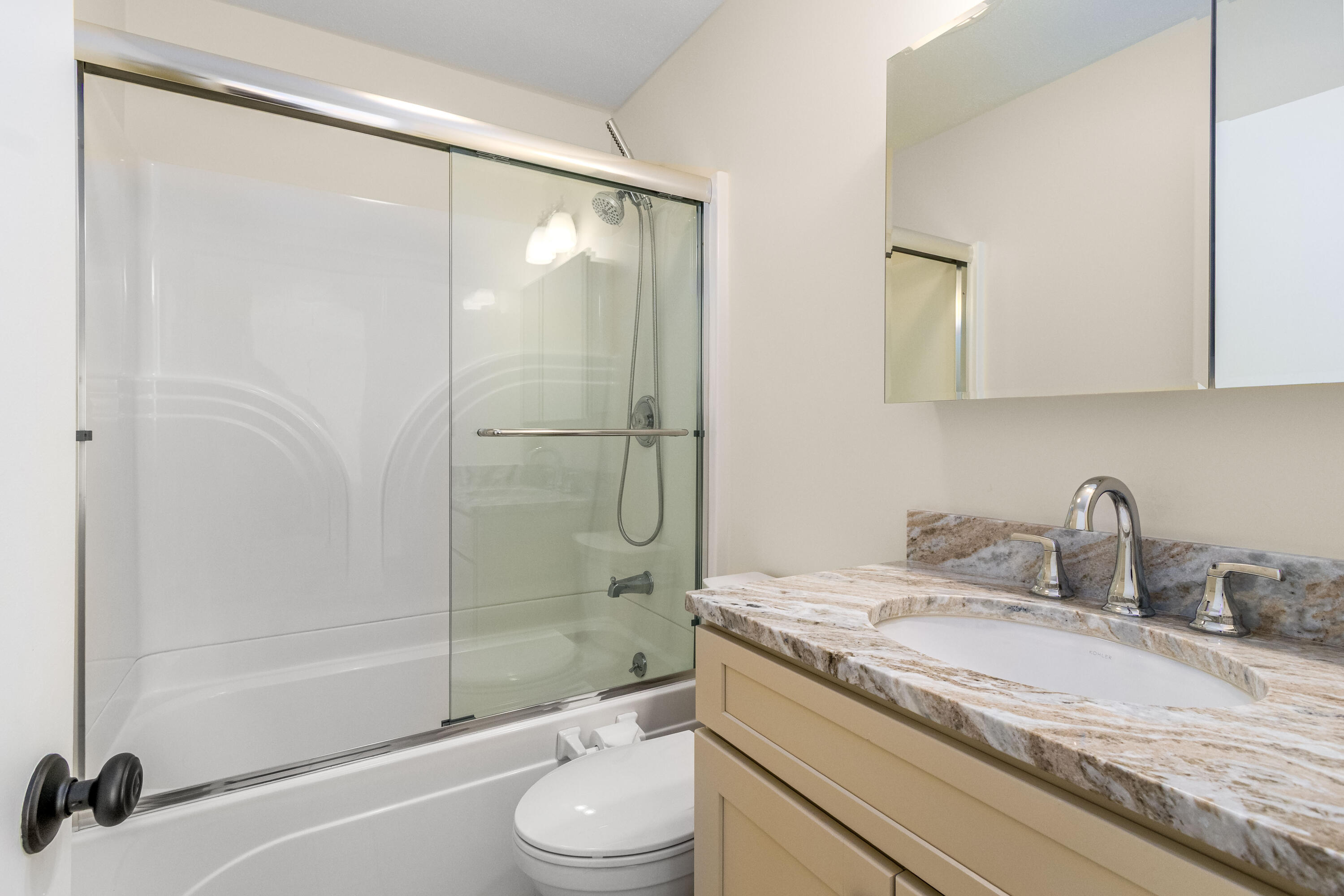 48 Middlecott Lane, Unit 48 Brewster, MA 02631 - Photo 12 of 36 a bathroom with a granite countertop sink toilet and shower