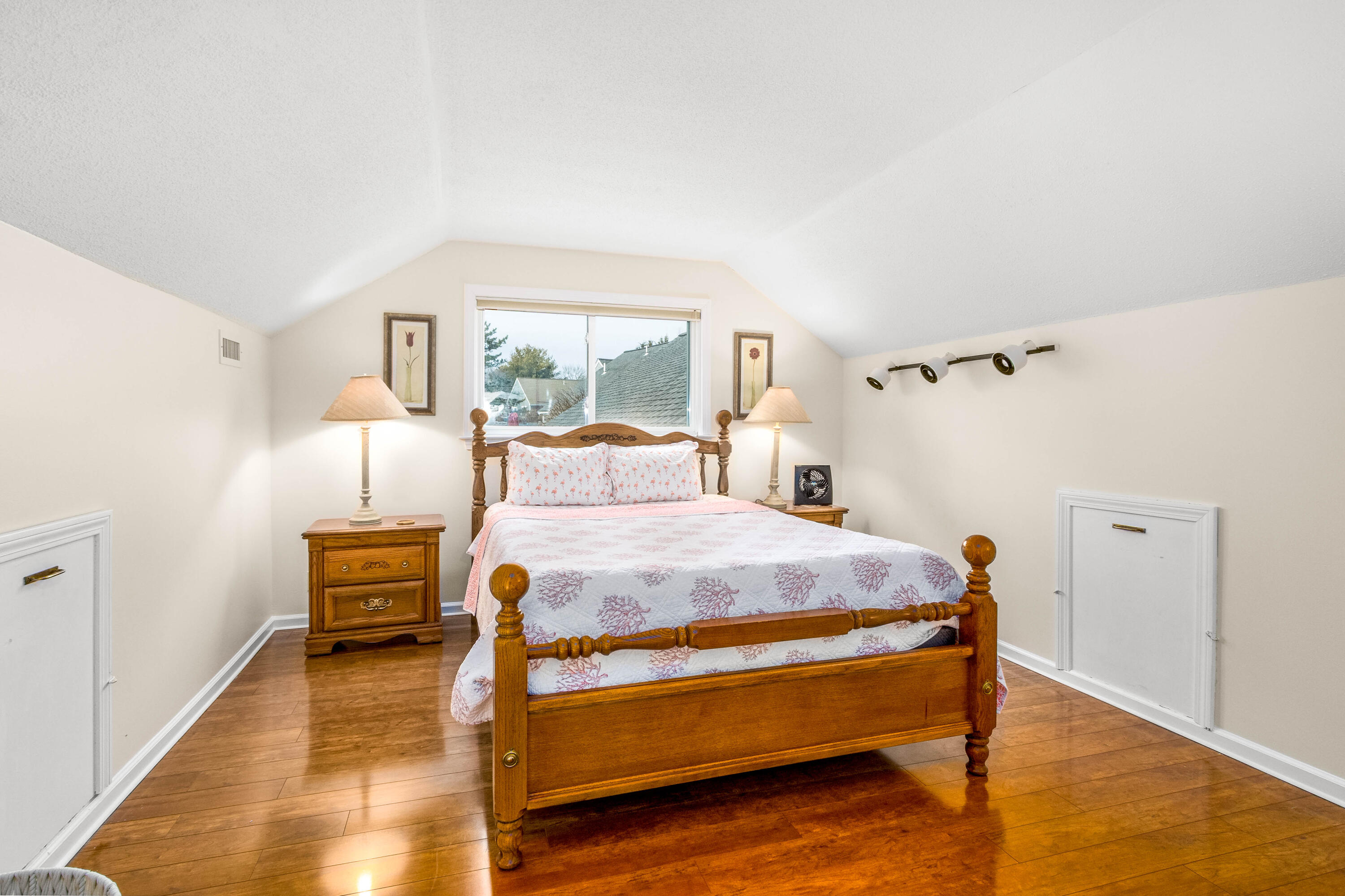 48 Middlecott Lane, Unit 48 Brewster, MA 02631 - Photo 17 of 36 a bedroom with a bed and wooden floor