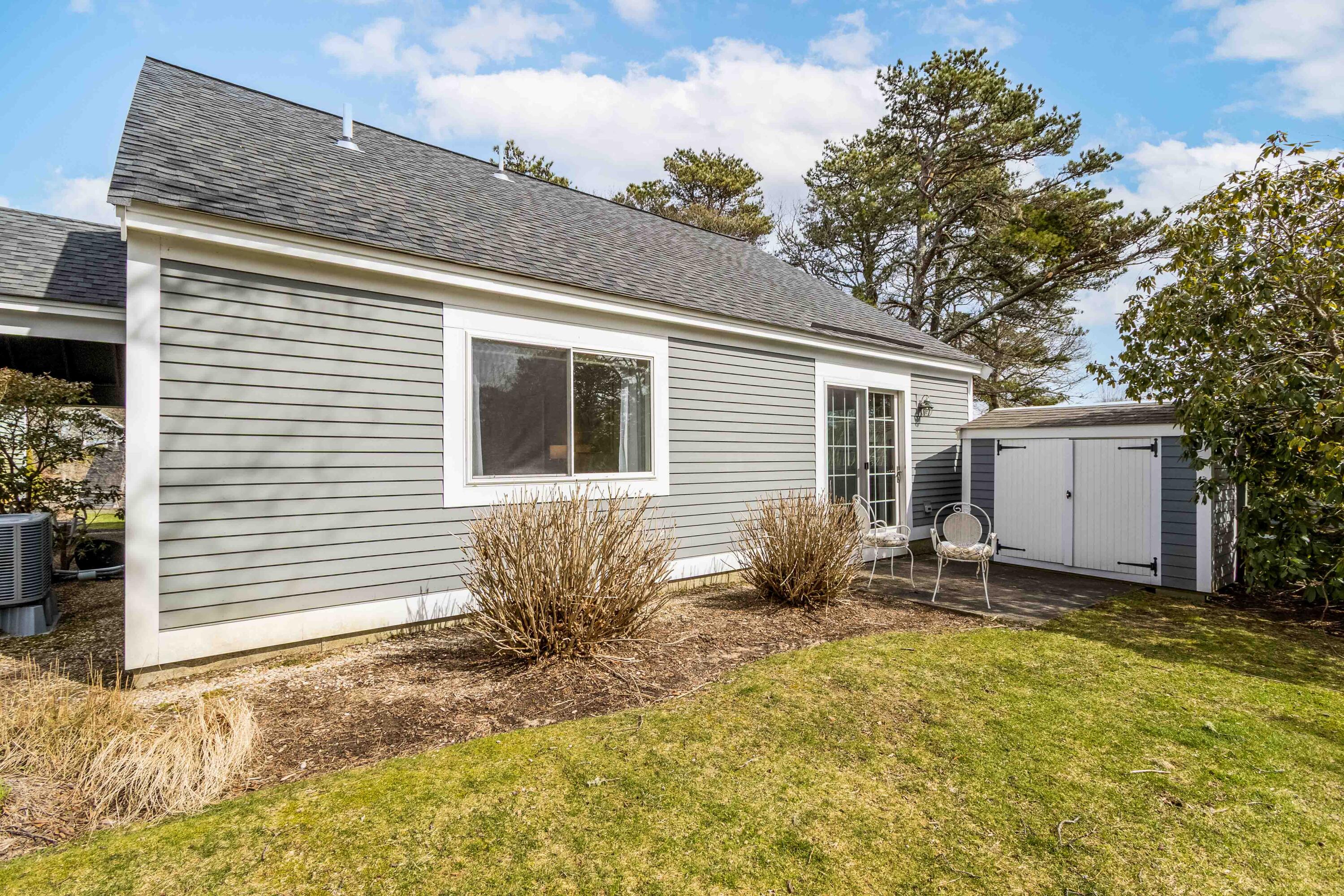 48 Middlecott Lane, Unit 48 Brewster, MA 02631 - Photo 20 of 36 a backyard of a house
