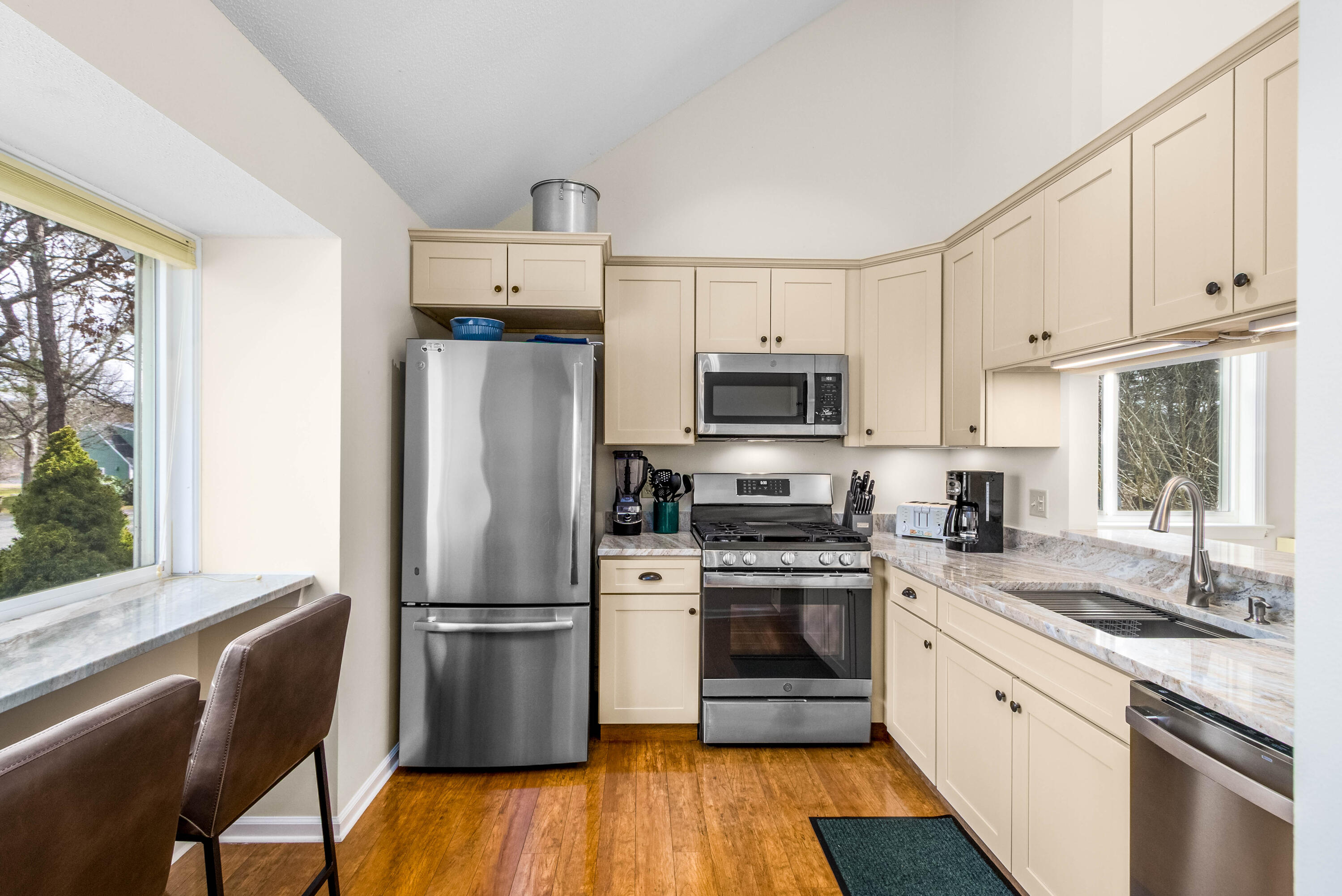 48 Middlecott Lane, Unit 48 Brewster, MA 02631 - Photo 2 of 36 a kitchen with a refrigerator stove and sink