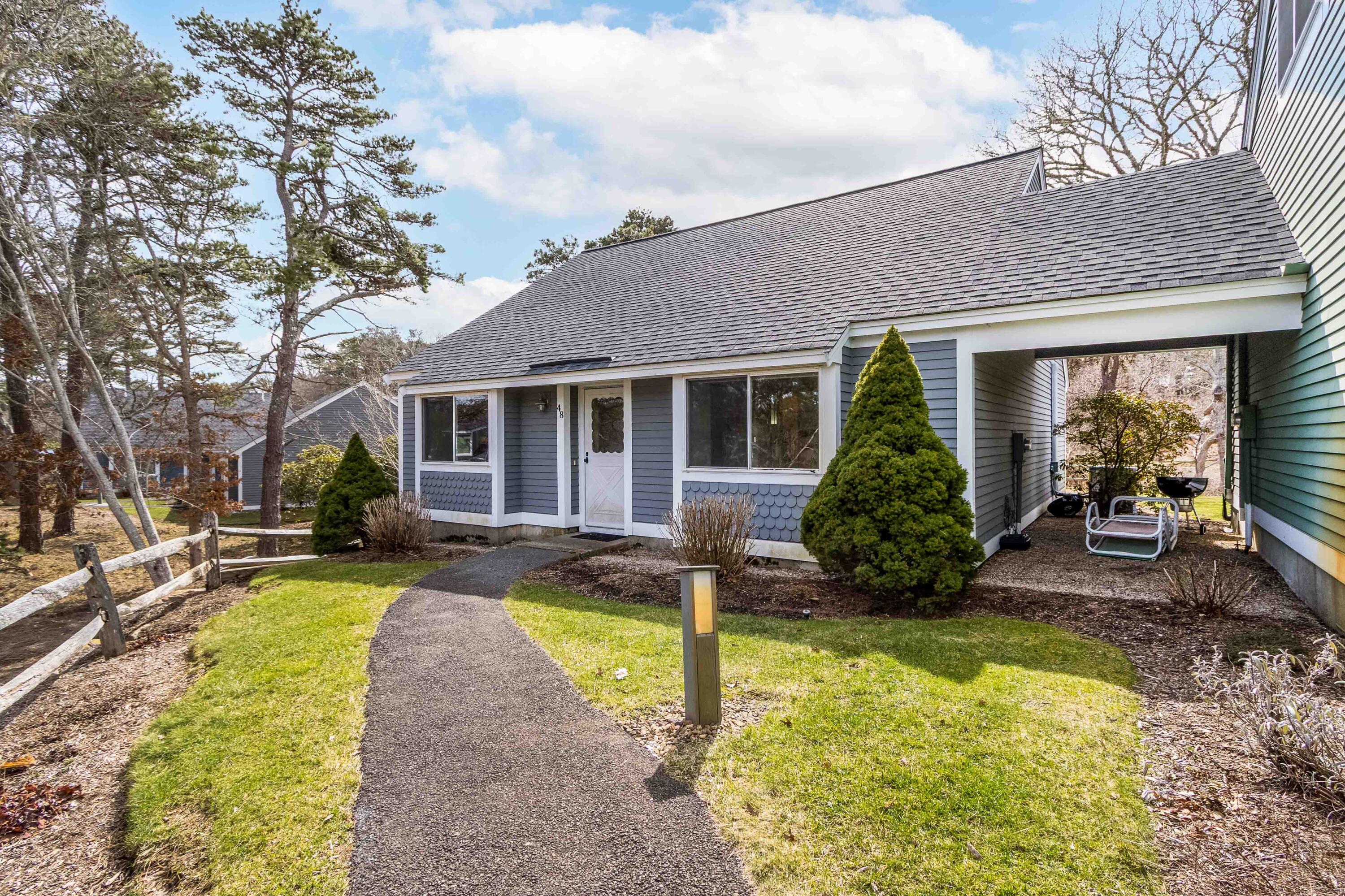 48 Middlecott Lane, Unit 48 Brewster, MA 02631 - Photo 22 of 36 a view of a house with a yard patio and swimming pool