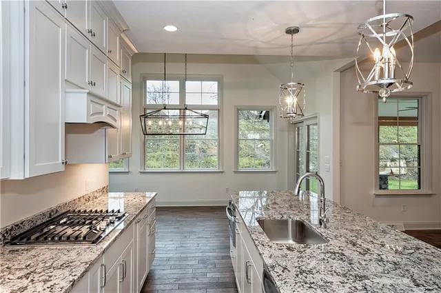 a kitchen with furniture and window