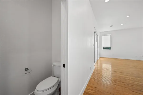 a bathroom with a toilet and a shower