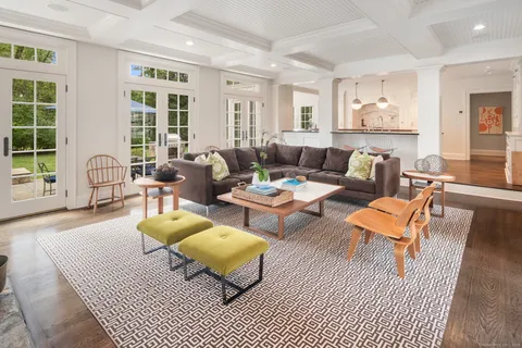 a living room with furniture and a table