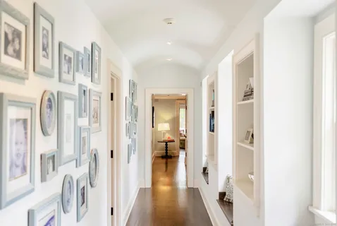 a bedroom with a bed and a table