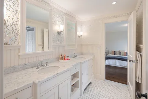 a bedroom with a bed and a table