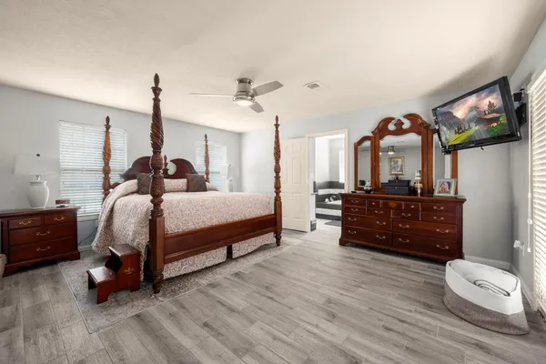 a bedroom with a bed and a dresser