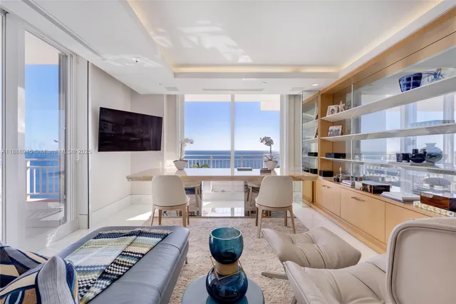 a living room with fireplace furniture and a flat screen tv