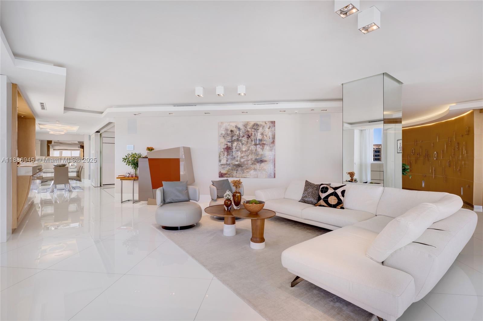 791 Crandon Boulevard, Unit 1408 Key Biscayne, FL 33149 - Photo 12 of 54 a living room with furniture and a large window