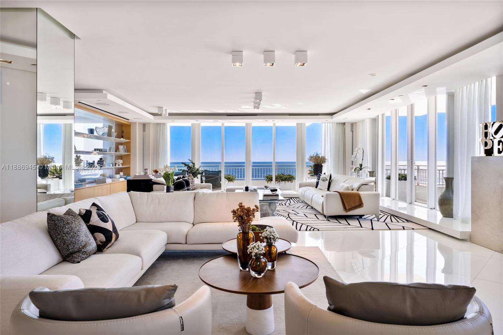 791 Crandon Boulevard, Unit 1408 Key Biscayne, FL 33149 - Photo 13 of 54 a living room with furniture and a large window