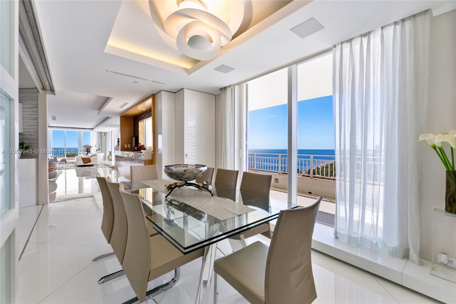 791 Crandon Boulevard, Unit 1408 Key Biscayne, FL 33149 - Photo 14 of 54 a view of a dining room with furniture window and outside view