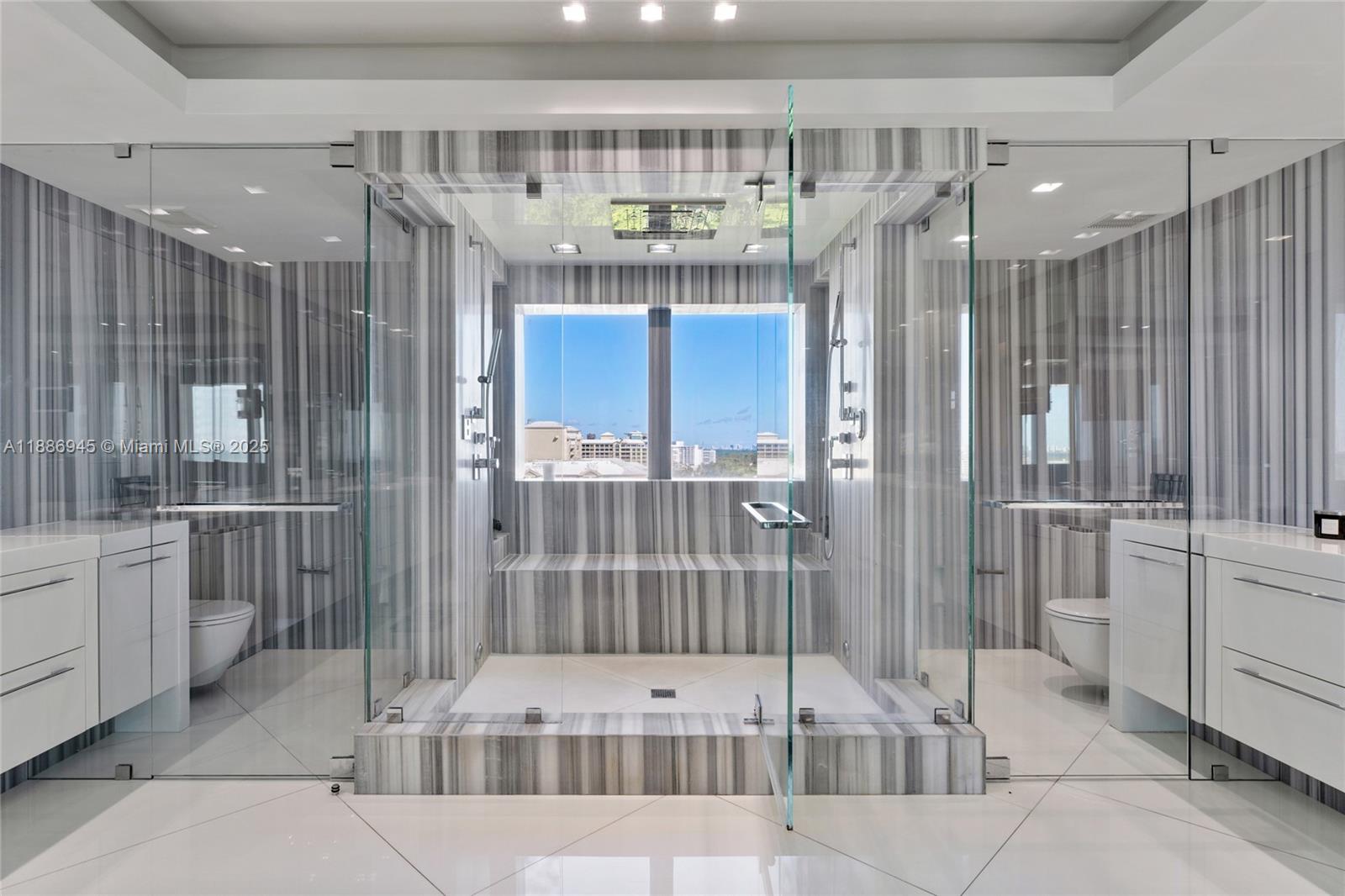 791 Crandon Boulevard, Unit 1408 Key Biscayne, FL 33149 - Photo 20 of 54 a bathroom with a tub shower and view of bathroom