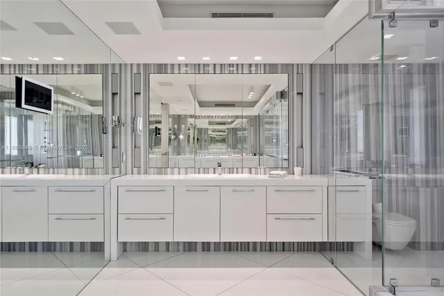 a kitchen with stainless steel appliances kitchen island granite countertop a table and chairs