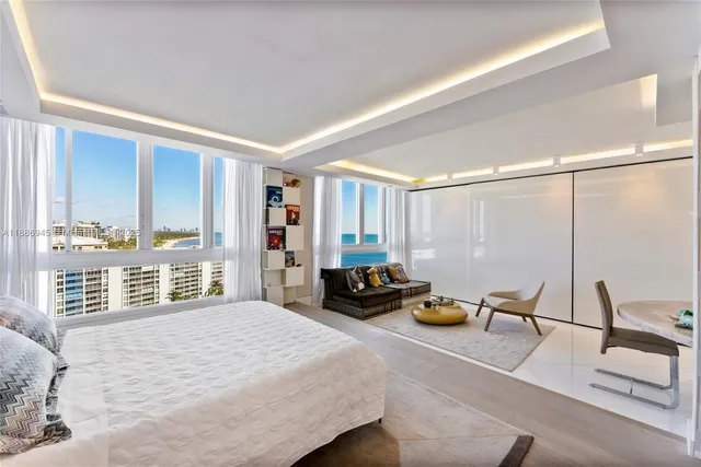 a bedroom with furniture and a window