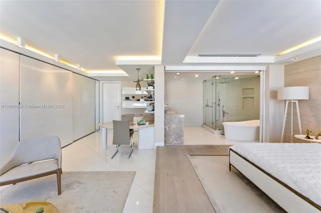 a living room with a bed and furniture