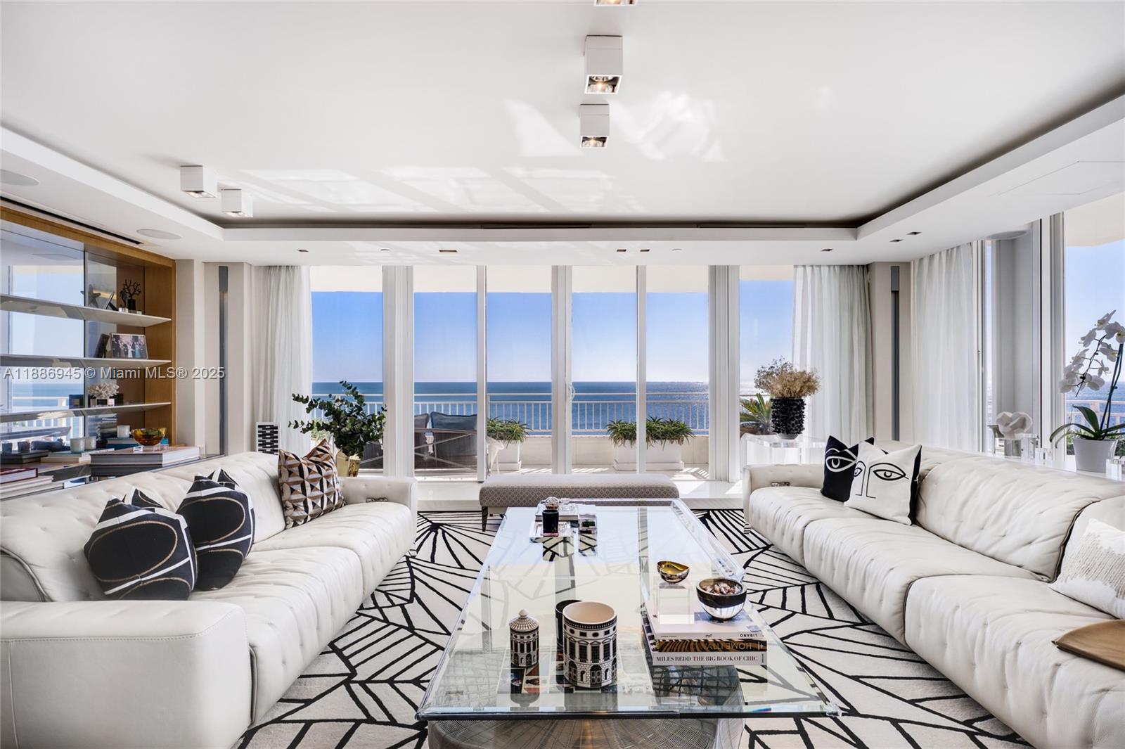 791 Crandon Boulevard, Unit 1408 Key Biscayne, FL 33149 - Photo 7 of 54 a living room with furniture large window and rug