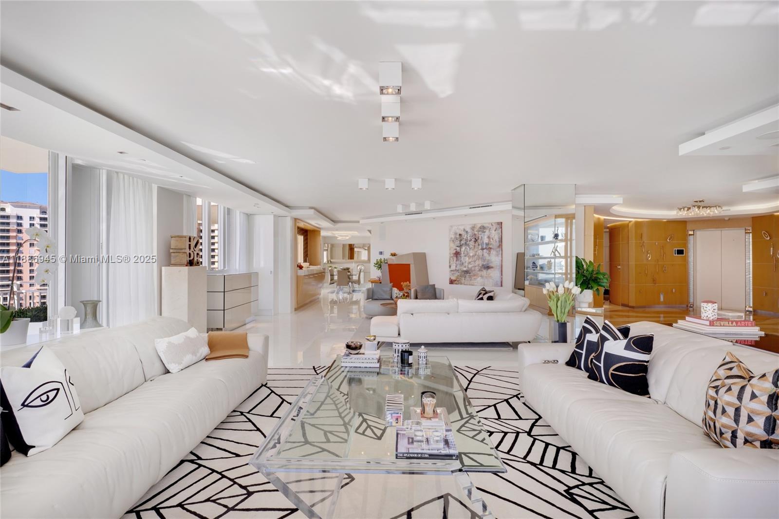 791 Crandon Boulevard, Unit 1408 Key Biscayne, FL 33149 - Photo 8 of 54 a living room with furniture and a large window