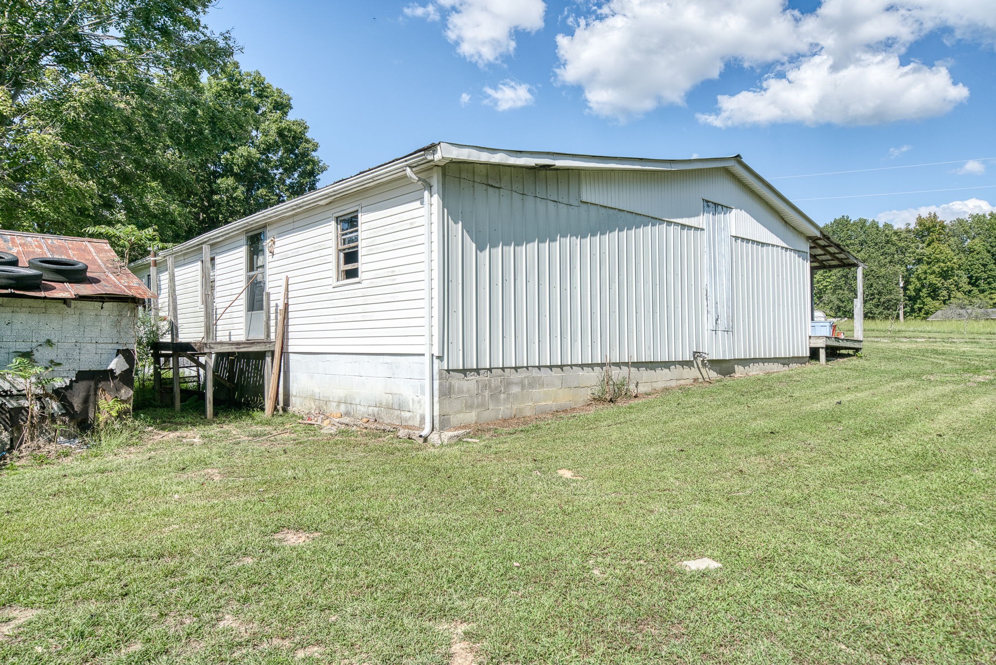 7331 Ashburn Road Baxter, TN 38544 - Photo 17 of 62 a backyard of a house with table and chairs