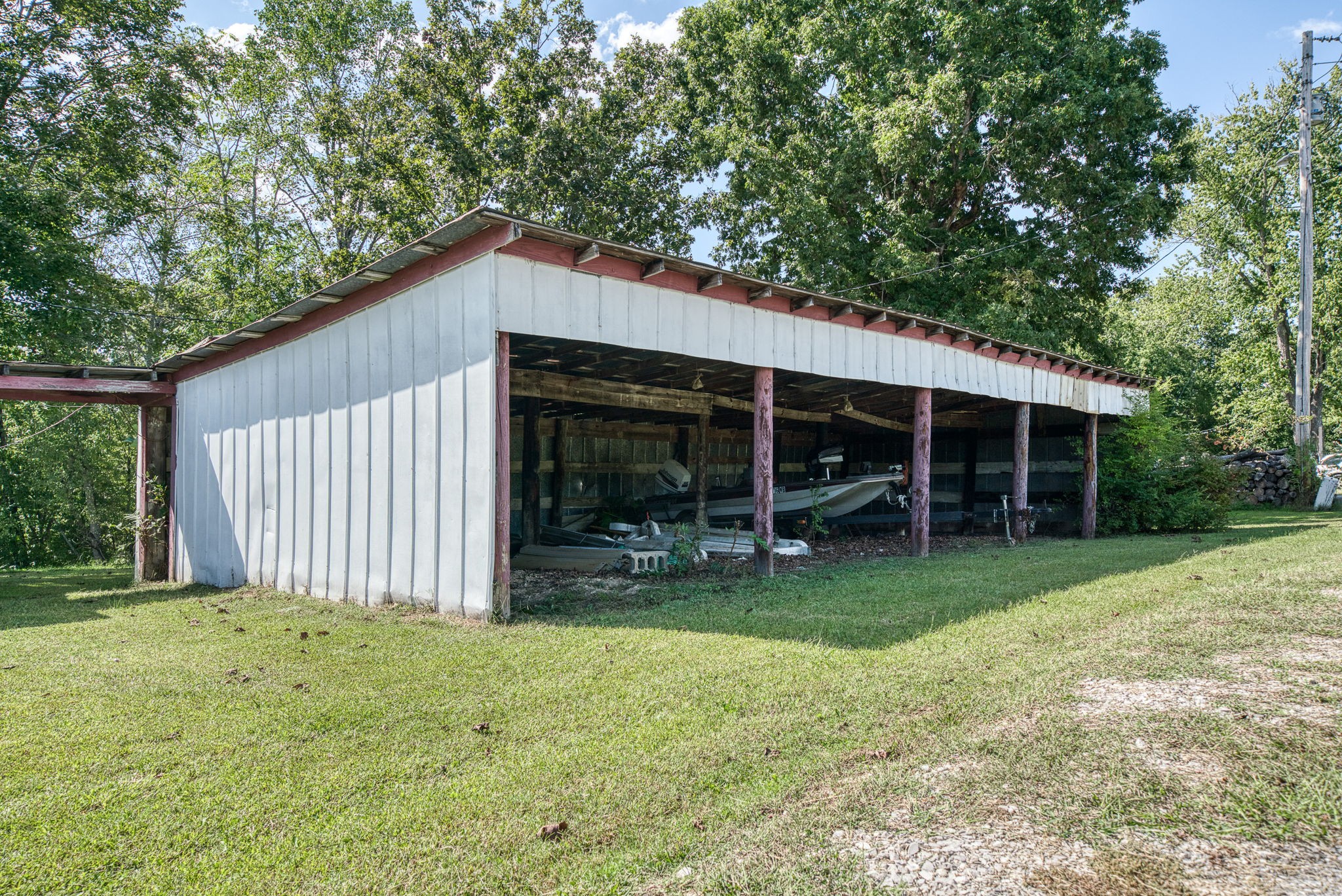 7331 Ashburn Road Baxter, TN 38544 - Photo 19 of 62 a view of a house with a yard and a large tree