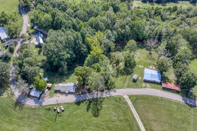 a view of a chair and fire pit in the backyard