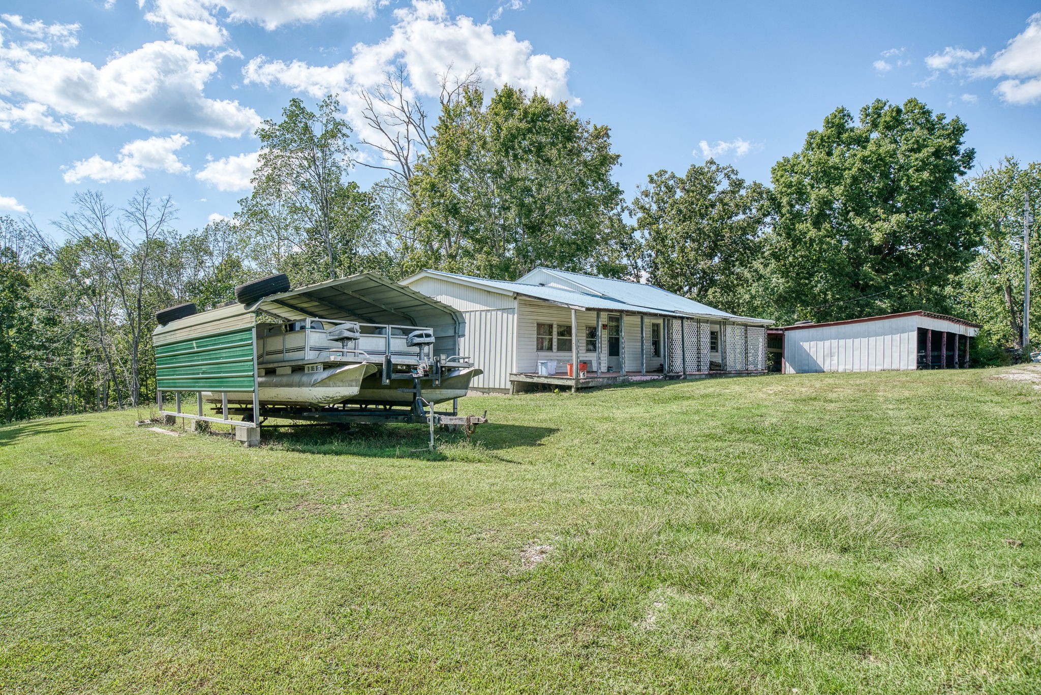 7331 Ashburn Road Baxter, TN 38544 - Photo 3 of 62 a view of a house with backyard and sitting area