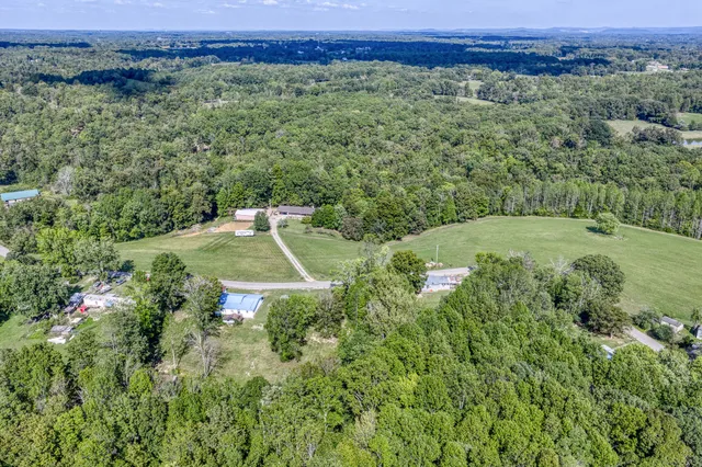 a view of a livingroom with a fireplace and window