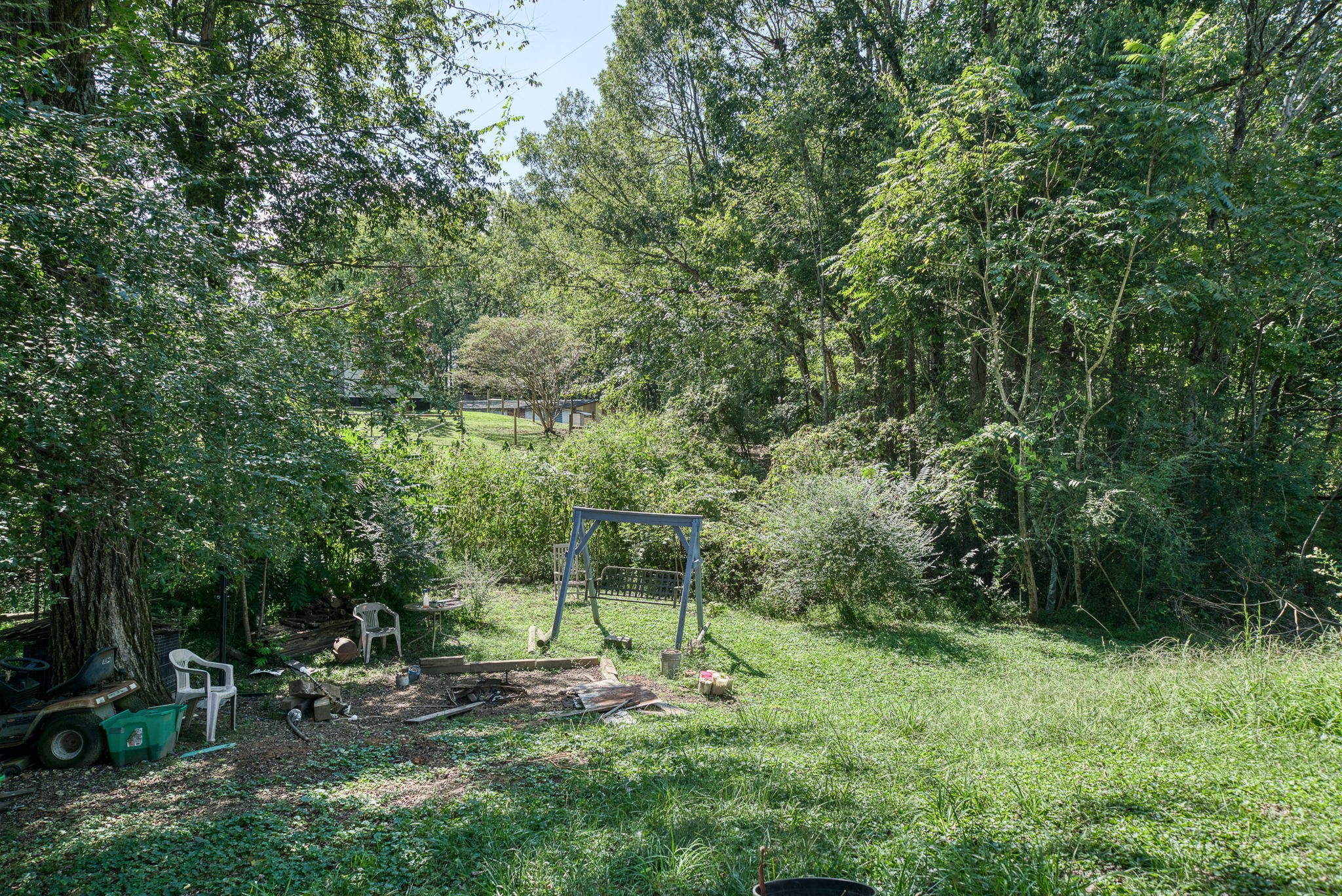 7331 Ashburn Road Baxter, TN 38544 - Photo 36 of 62 a view of a chair and fire pit in the backyard