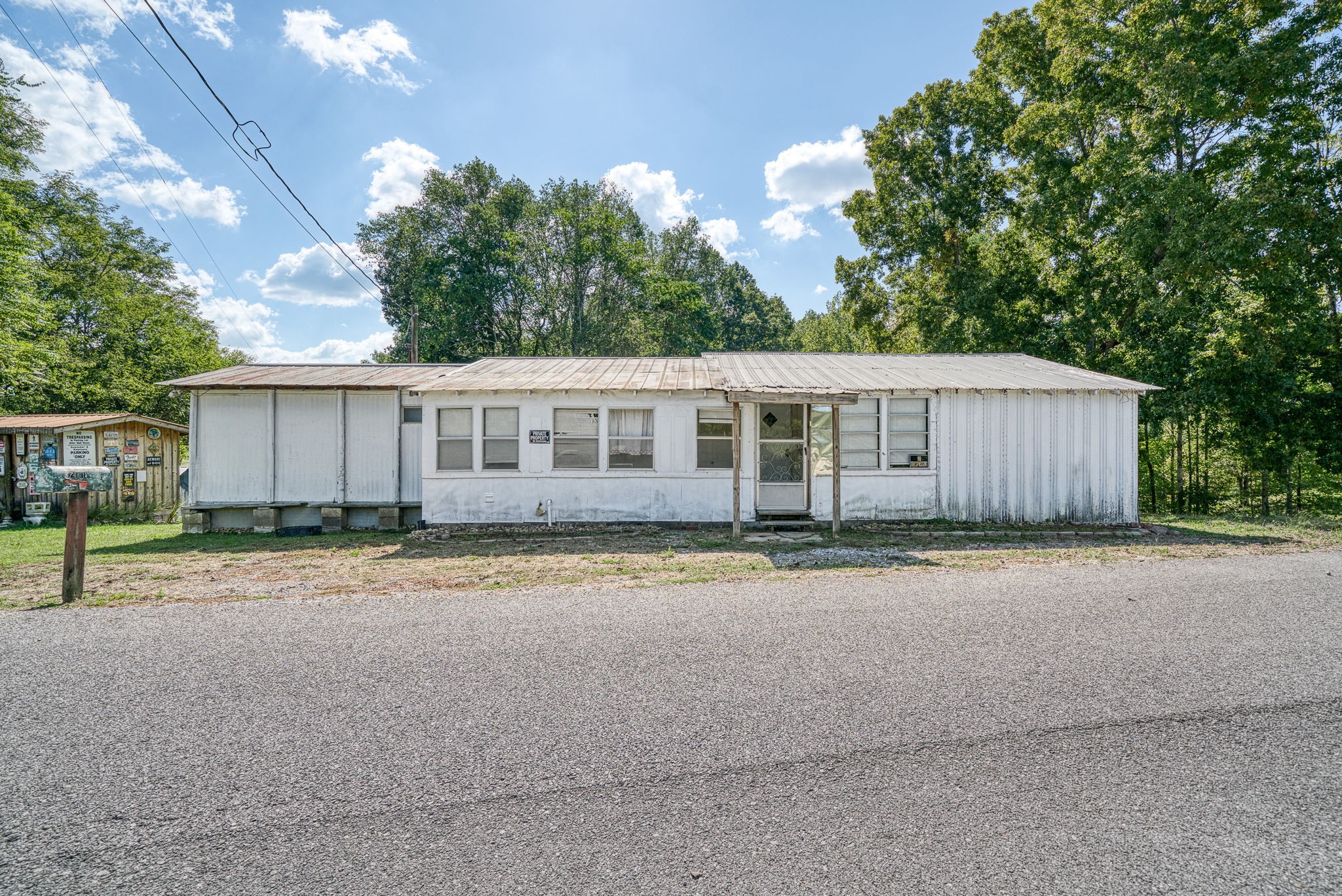 7331 Ashburn Road Baxter, TN 38544 - Photo 37 of 62 a view of a house with a backyard and a garage