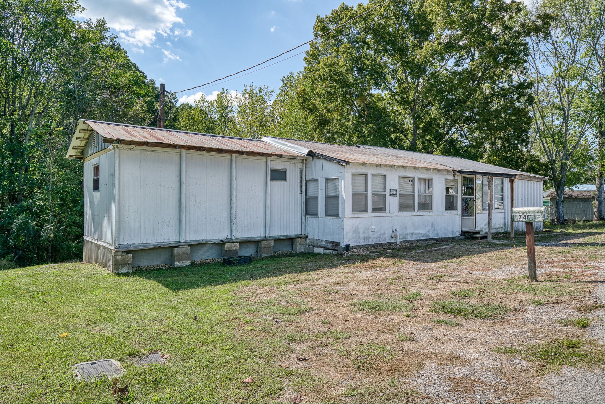 7331 Ashburn Road Baxter, TN 38544 - Photo 38 of 62 a view of a house with backyard and sitting area