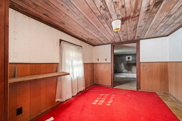 a kitchen with stainless steel appliances granite countertop a sink refrigerator and cabinets