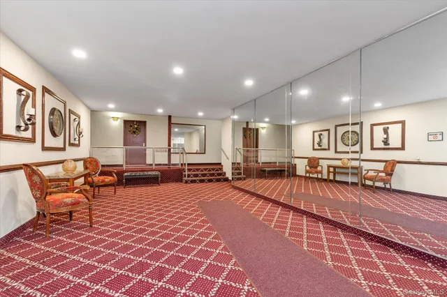 a large room with lots of chairs and a table