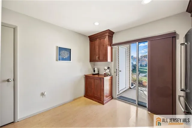a view of a kitchen with an entryway and furniture